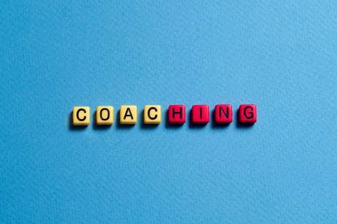 Coaching - word concept on cubes Stock Photos