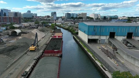 Coal aggregate stone on barge. Harbor inlet in Stamford CT, USA. Aerial. Stock Footage 205584751