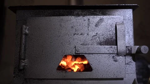 Coal burning inside an Iron Stove  2 Stock Footage 239818341