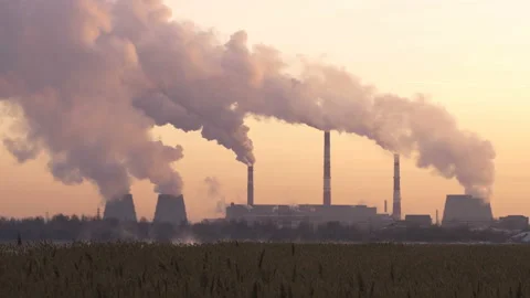 Coal burning power plant with smoke stacks Stock Footage