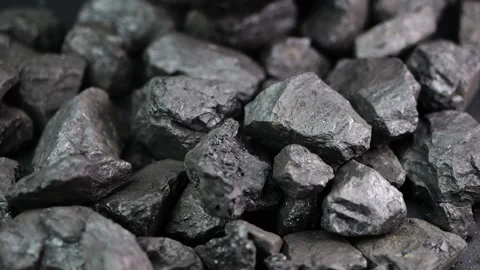 Coal chunks shatter on impact in slow motion, revealing textures. A strikin.. Stock Footage 300261226