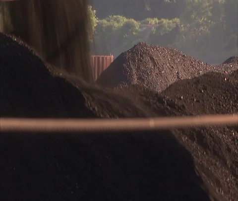 Coal falling onto coal car piled high with coal. Stock Footage 86694953