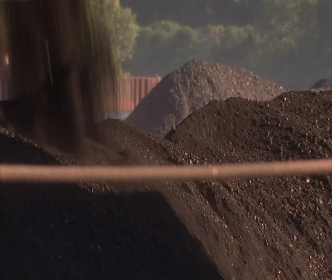 Coal falling onto coal car piled high with coal, zoom out Stock Footage 86694993