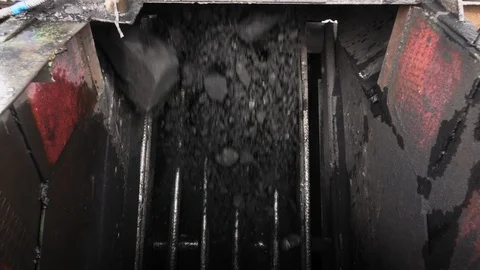 Coal falls through the filter. Slow motion Stock Footage 91788864