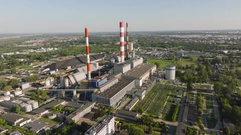 Coal fired power plant emitting steam from tall chimneys aerial view Stock Footage 344879757