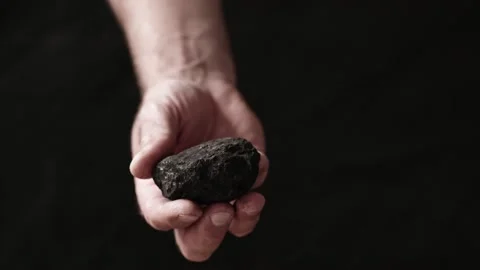 Coal in the hand of a miner. Stock Footage 199113504