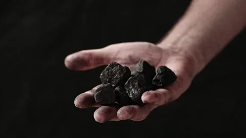 Coal in the hand of a miner. Stock Footage 201297878