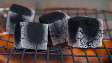 Coal for a hookah is kindled on fire. Video stock 119556240