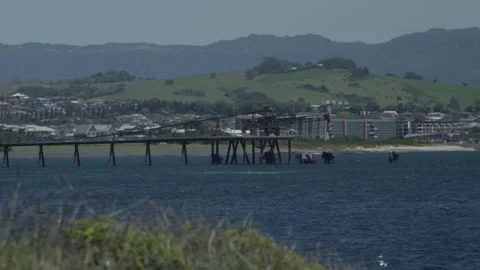 Coal Loading Pier Against Pristine Blue Ocean and Mountain Coastline 스톡 동영상 332109692