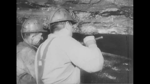 Coal miner working in mine - 1951 Stock Footage 107273376