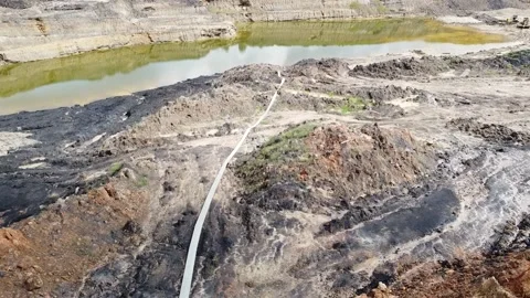 Coal mining area pool in Penajam Paser area, East Kalimantan Stock Footage 169871697