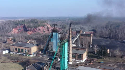 Coal mining mine. Thick smoke comes out of the chimney. Adverse outdated working Stock Footage 175224850