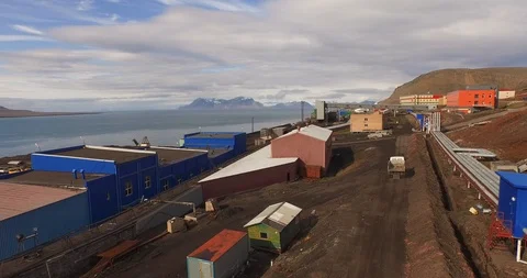 Coal mining settlement on the shore of the Arctic Ocean. Сold northern land of Video stock 121812314