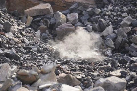 Coal mining site with dust pollution, methane gas releasing area Stock Photos