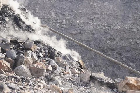 Coal mining site with dust pollution, methane gas releasing area 库存照片