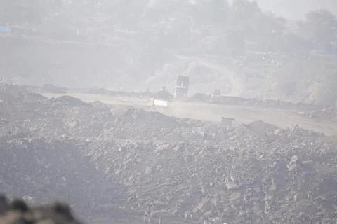 Coal mining site with dust pollution, methane gas releasing area Foto stock