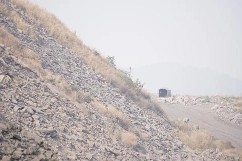 Coal mining site with dust pollution, methane gas releasing area Foto stock