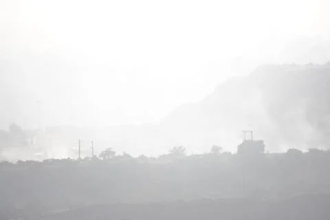 Coal mining site with dust pollution, methane gas releasing area Stock Photos