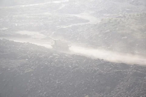 Coal mining site with dust pollution, methane gas releasing area 库存照片