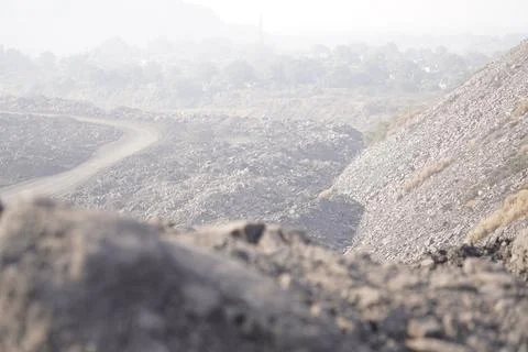 Coal mining site with dust pollution, methane gas releasing area 库存照片