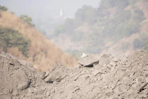 Coal mining site with dust pollution, methane gas releasing area Stock Photos