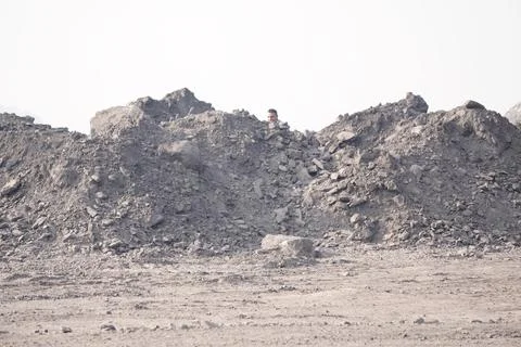 Coal mining site with dust pollution, methane gas releasing area Stock Photos