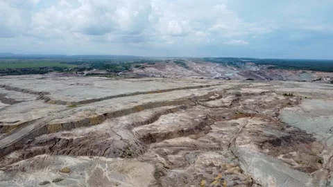 Coal mining surrounded by oil palm plantations looks very barren Stock Footage 274380090