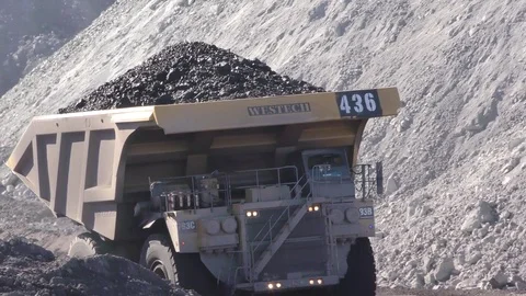 Coal Mining Truck Hauling in Open Mine Pit Wyoming Stock Footage