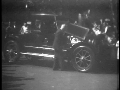 A coal-powered automobile is driven through Philadelphia, Pennsylvania, in 1932. Stock Footage 79460771