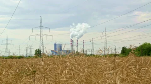 Coal powered electrical generation plant shot from distance in the afternoon Stock Footage 53294667