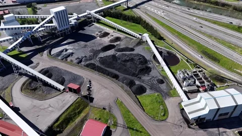 Coal processing and storage facility with conveyors and highways Stock Footage 308316850