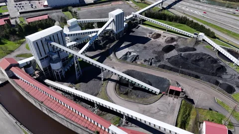 Coal processing complex with conveyors and canal in industrial area Stock Footage 308318244