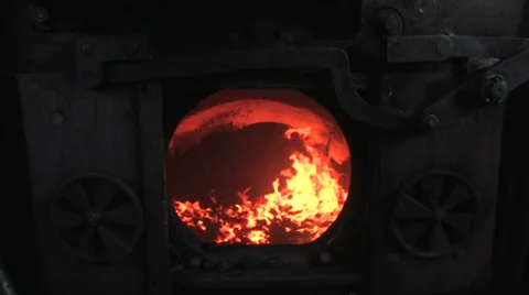 Coal shoveled into the boiler of a Stock Video Pond5