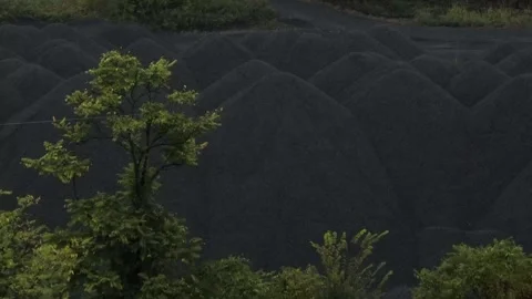 Coal storage and handling at operating Rust Belt steel facility Stock Footage 323300131