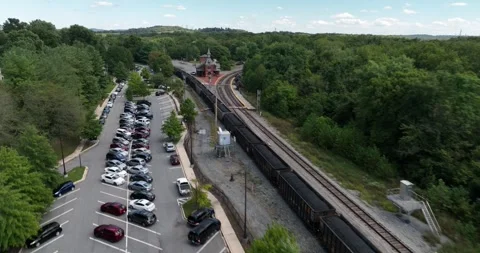 A Coal Train Passes Point of Rocks Railroad Depot Aerial Point of Rocks Maryland Stock Footage 335678574
