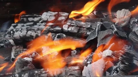 Coals are burning in the grill, close up. Blurred background, nobody Stock Footage 158322710