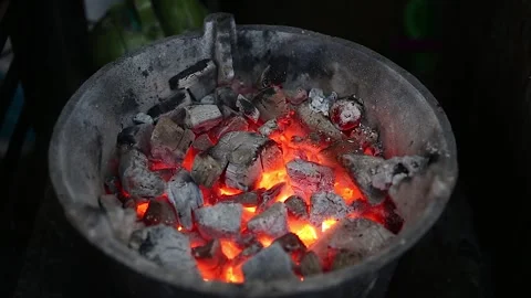 Coals for cooking, a substitute for stoves typical of Indonesian Stock Footage 265934529