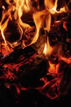 Coals in a fire close-up at night Stock Photos
