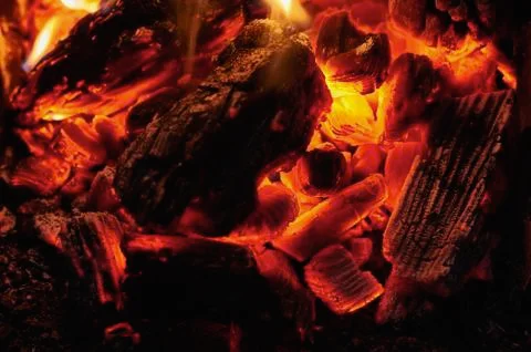Coals in a fire close-up at night Stock Photos