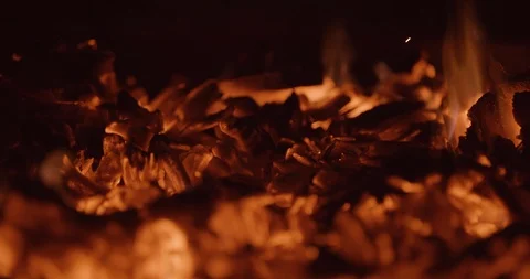Coals flicker in fire pit with flames Stock Footage 102790163