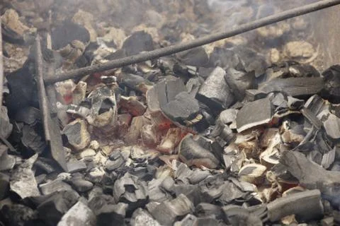 Coals in the grill. 스톡 사진