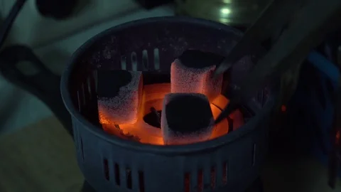 Coals for a hookah pipe heating Stock Footage 102532793
