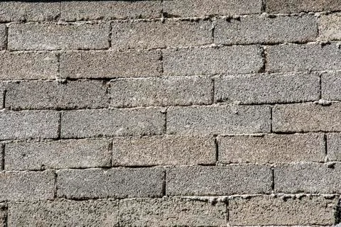 Coarse bricks of concrete a wall Stock Photos