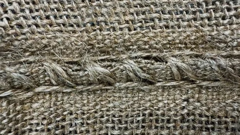 Coarse burlap fabric texture with stitched seam Stock Footage 340581177