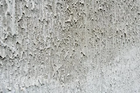 Coarse grey textured plaster wall background full frame close up for Stock Photos