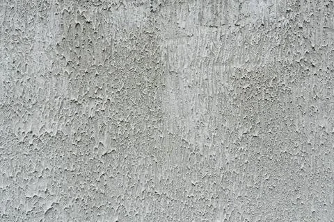Coarse grey textured plaster wall background full frame close up for Stock-Fotos