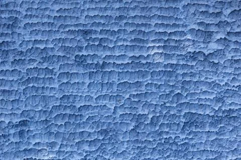 Coarse horizontal texture on concrete wall in blue color Stock Photos