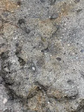 Coarse Weathered Sedimentary Rock Surface with Embedded Gravel and Stains Stock Photos
