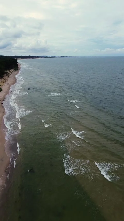 Coast of the Baltic Sea, waves rolling along the sandy shore Stock Footage 297660451