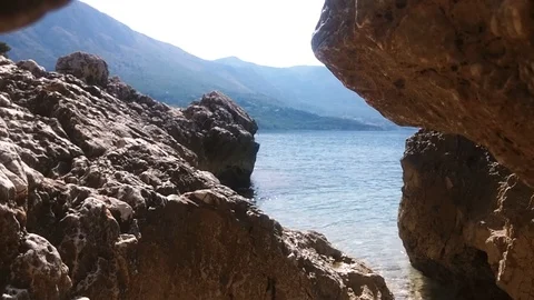Coast at beautiful blue sea surface. Stock Footage 90235724